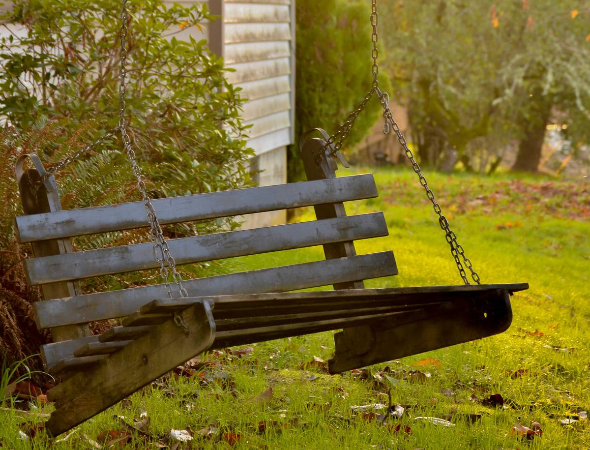 Comparison of outdoor patio swing seat replacement options showing fabric types and hardware quality